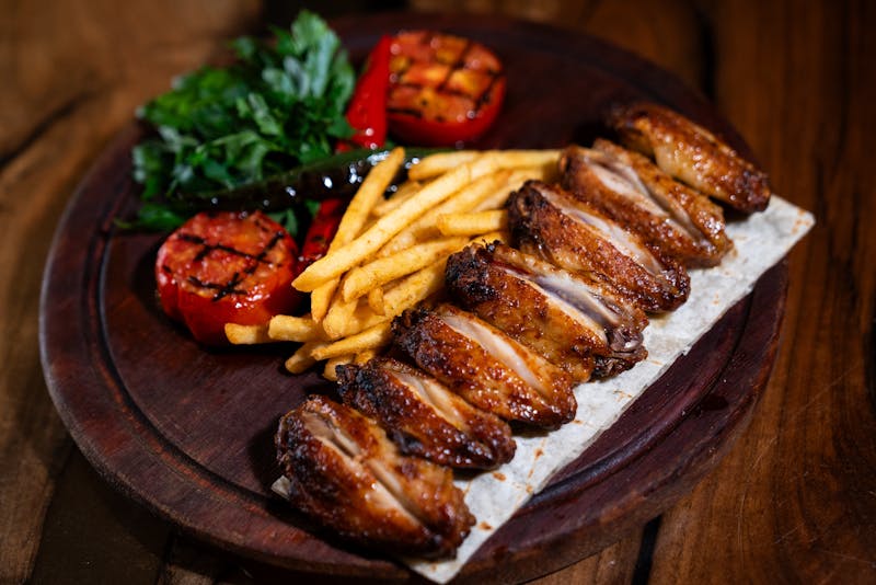 Full spread of food including wings, sides and drinks